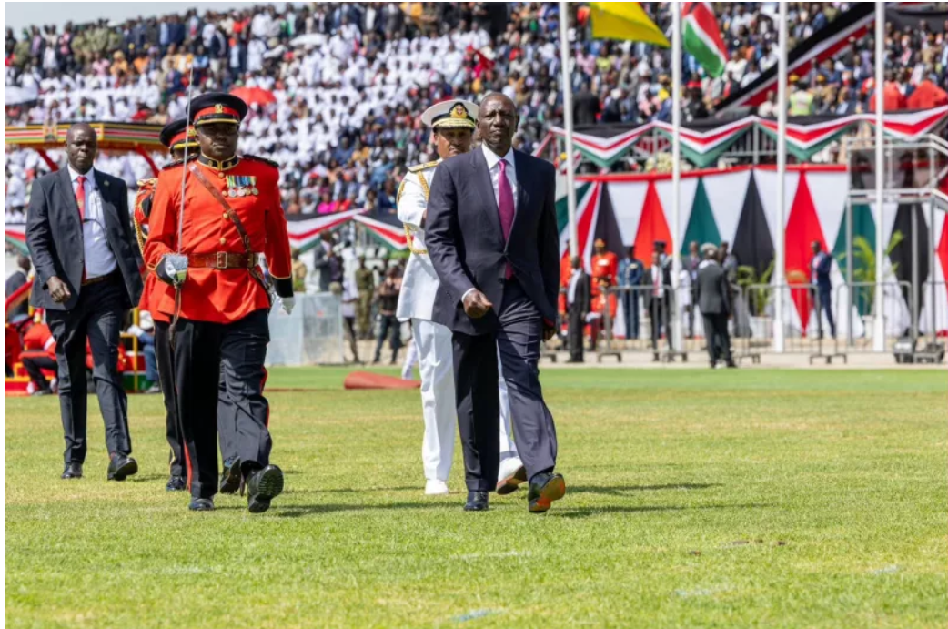 President William Ruto walking with military officials during Mashujaa Day celebrations